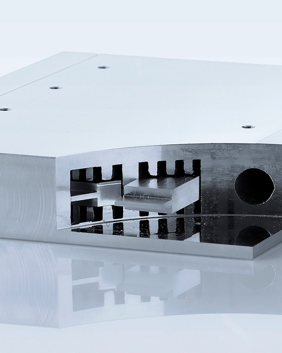 a white rectangular object with a black circle in the middle