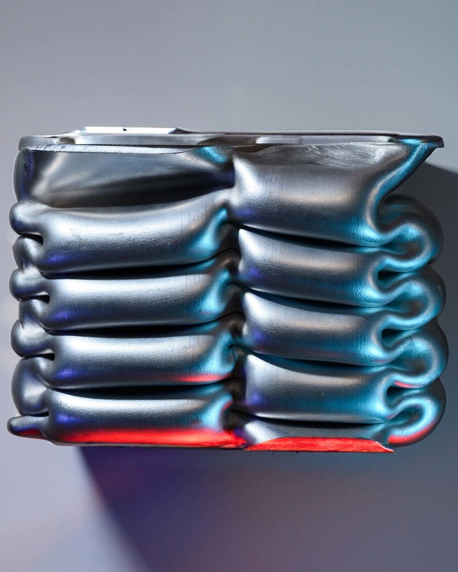 a stack of silver tubes