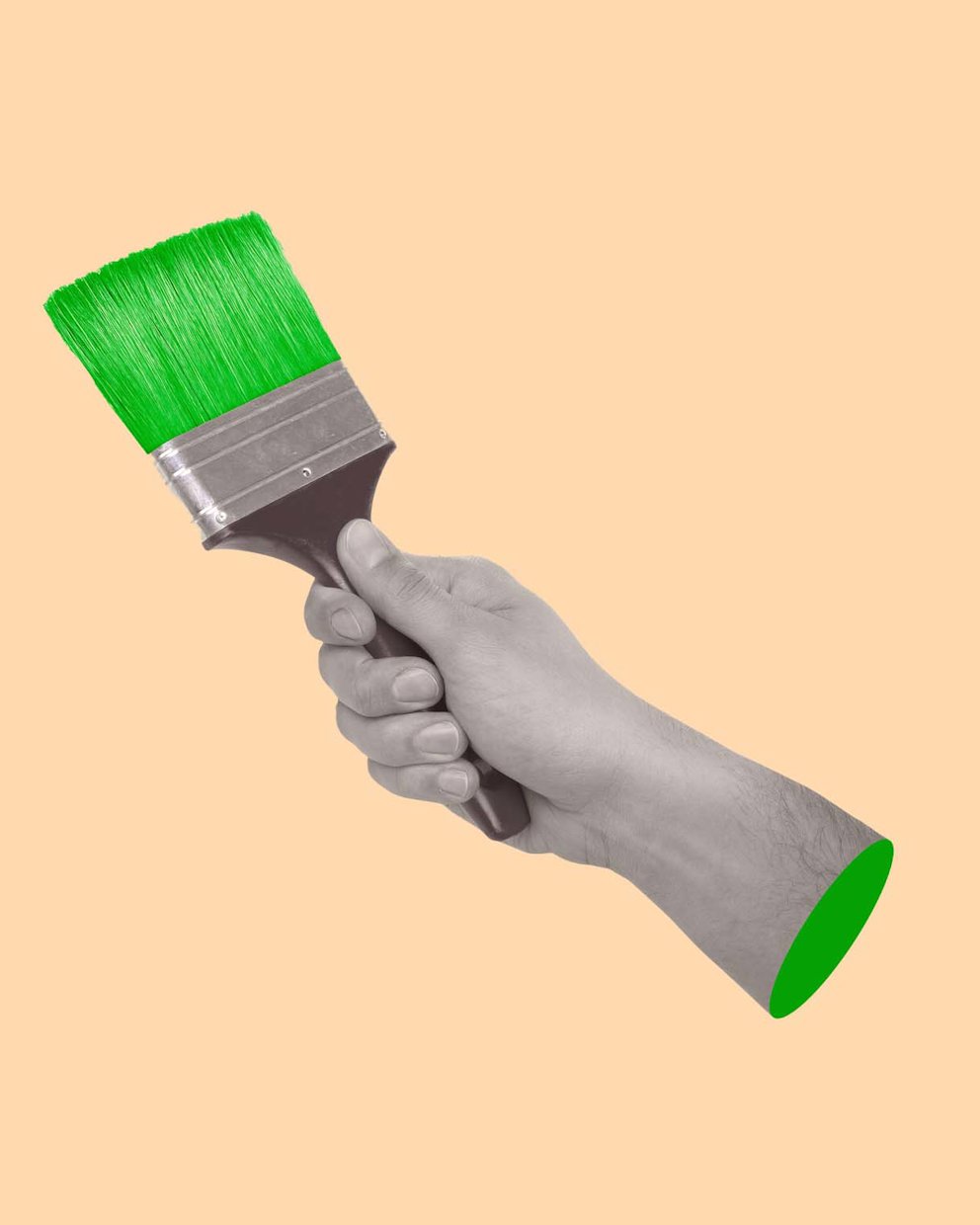 a hand holding a green paintbrush