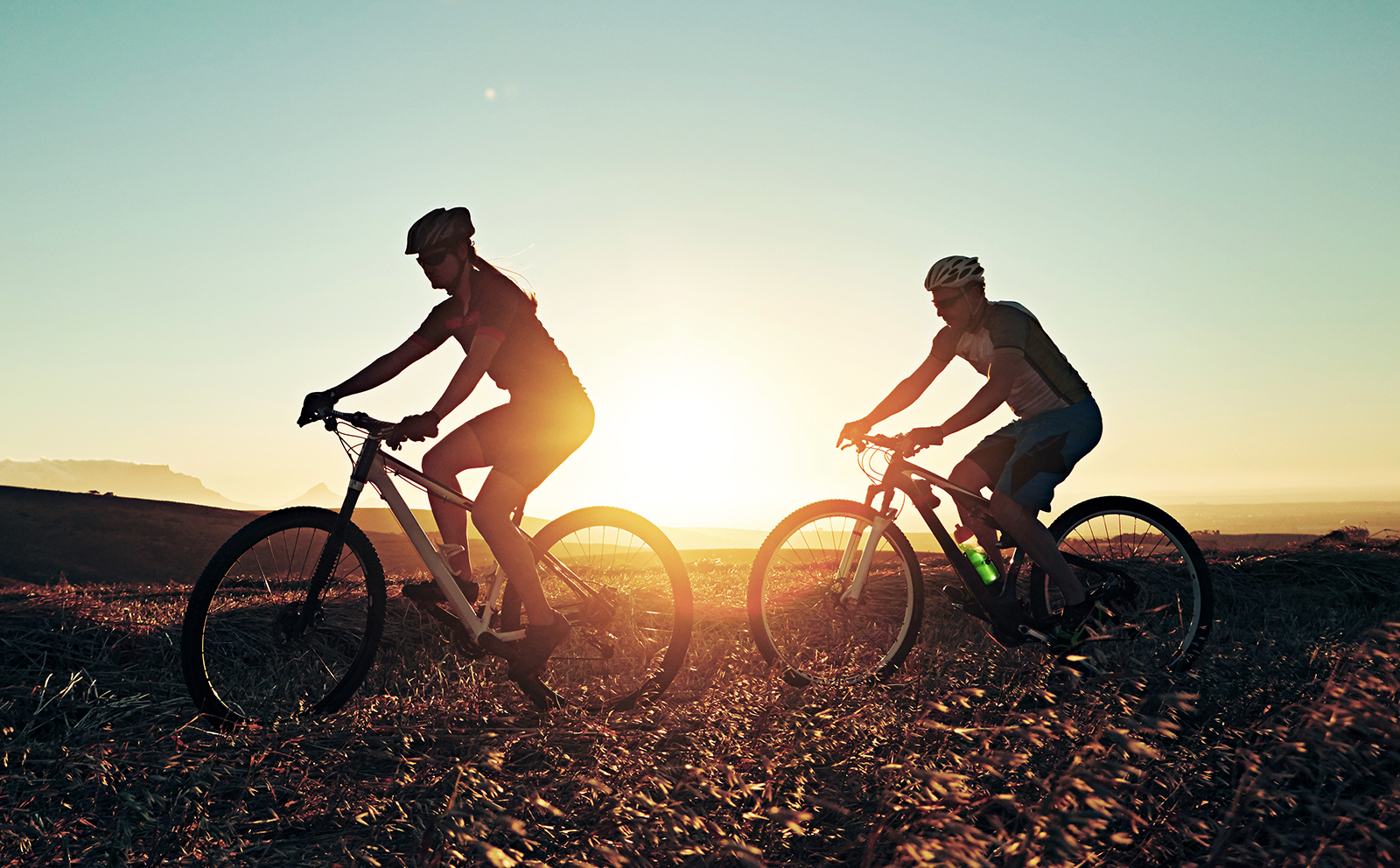 2 people riding bicycles
