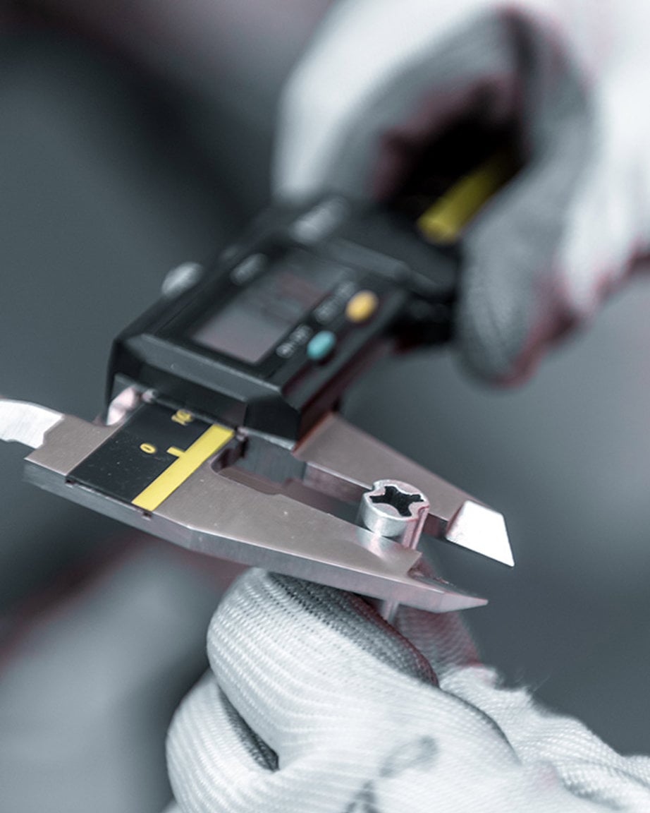 a person holding a measuring device