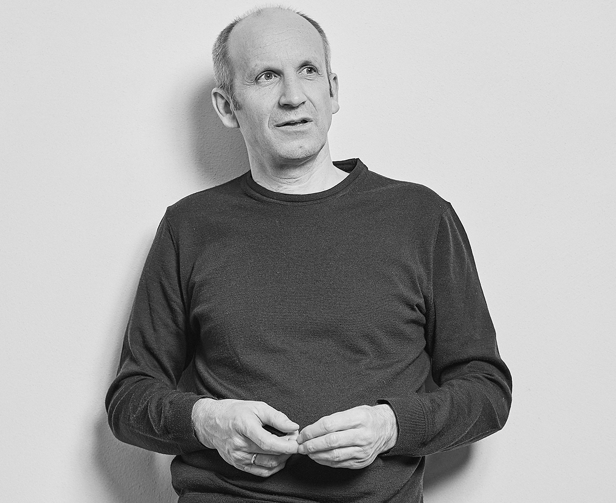 a man with his hands folded