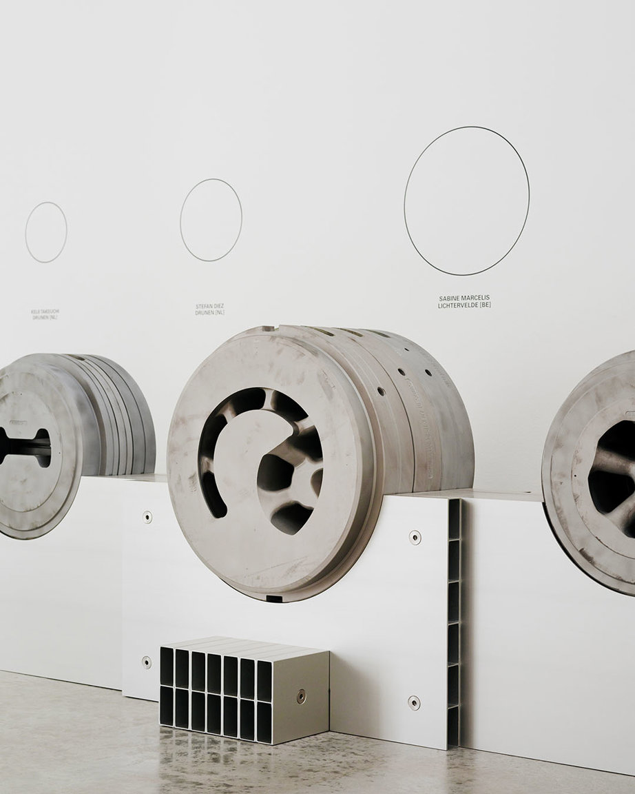 a group of metal wheels on a white surface