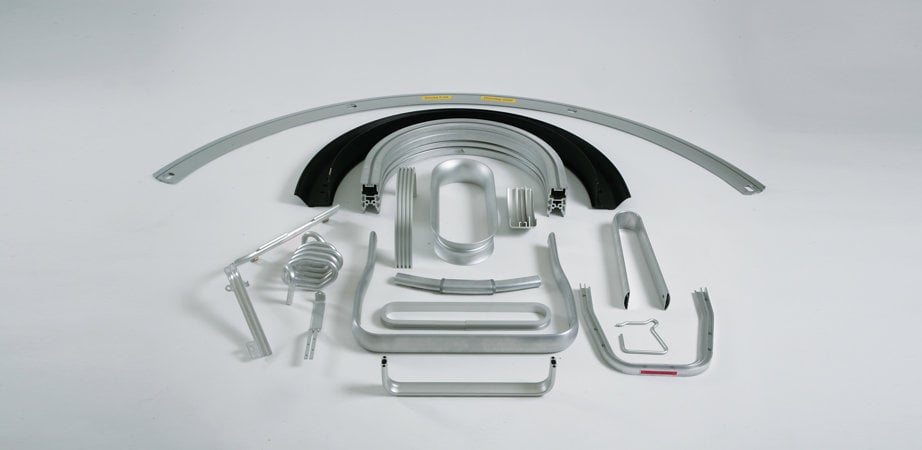 Studio photo showcasing the malleability of extruded aluminium profiles