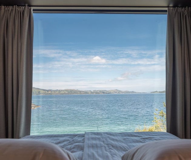 a view of the ocean from a window a view of the ocean from a window