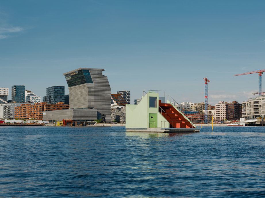 a body of water with buildings in the background