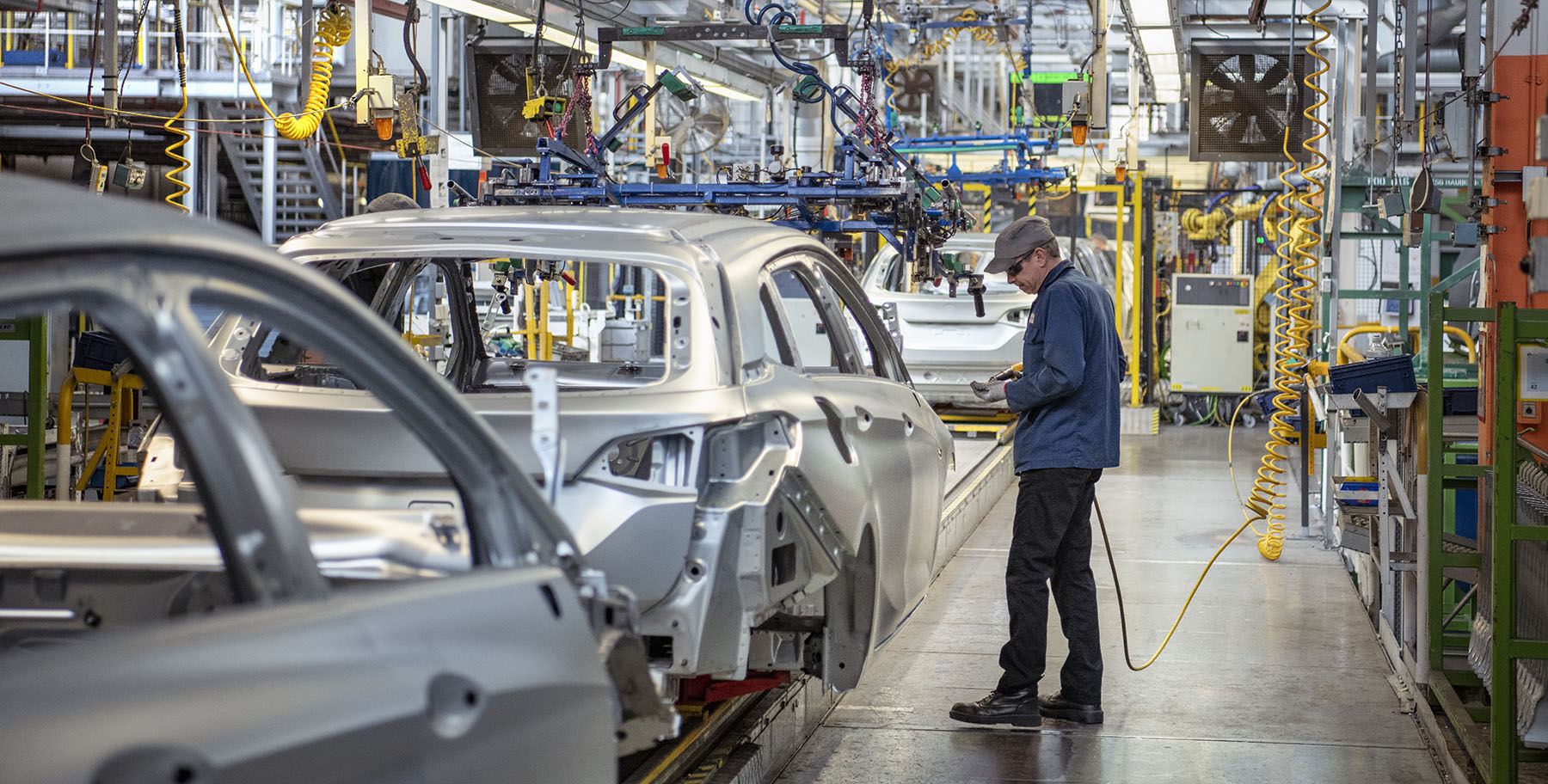 Working on an automotive vehicle assembly line