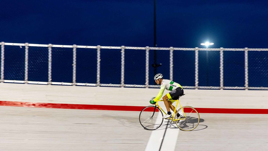 a man riding a bicycle on a track