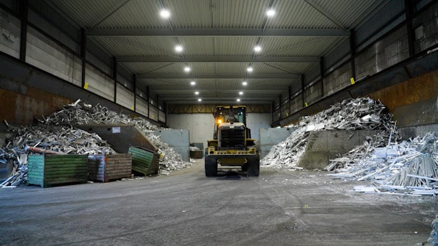a construction vehicle in a warehouse a construction vehicle in a warehouse