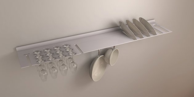 thin aluminium floating shelf with slits for stemmed glasses and dining plates
