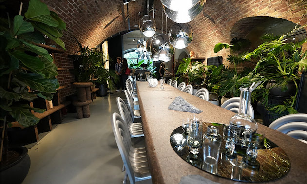 Tom Dixon Studio’s Hydro Chair, around an elegant dinner table, at London Design Festival 2023