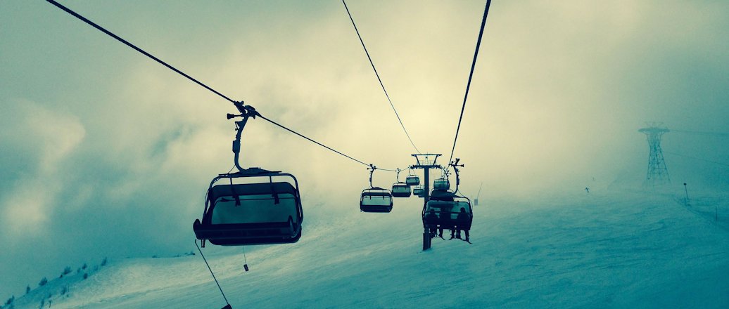 ski lift over snow slopes