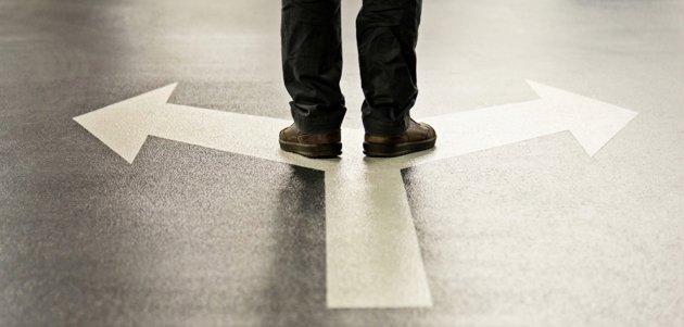 Person standing at a crossroad