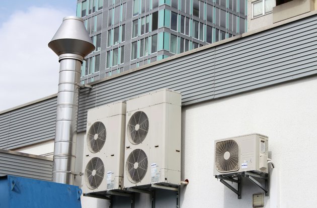 AC unites mounted on a building exterior wall