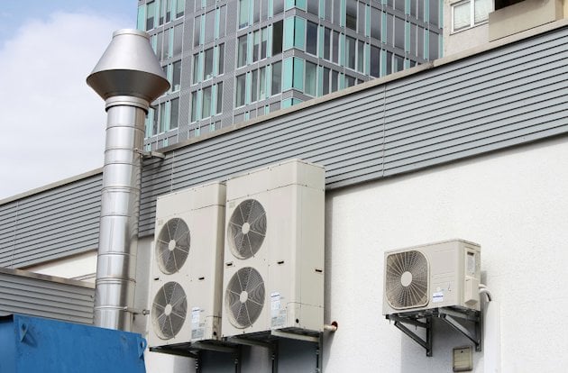 AC unites mounted on a building exterior wall