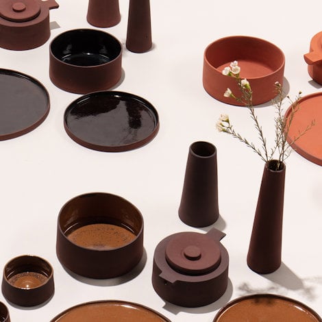 Studio ThusThat has created a range of tableware and tiles made from bauxite residue.