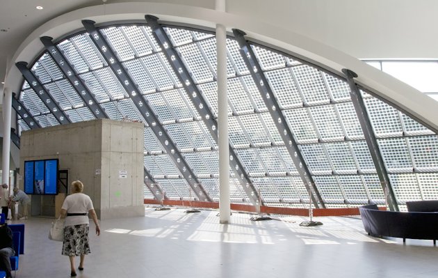 public building with large window with solar panels