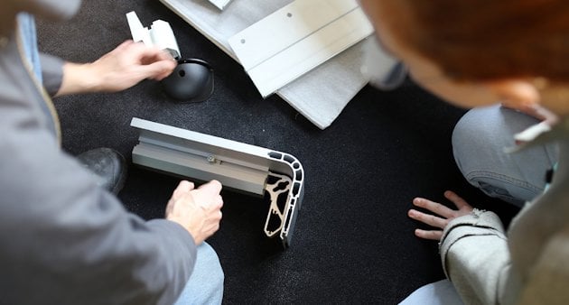 Designers examining an extruded aluminium profile